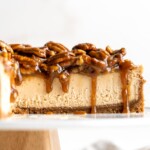 Pecan Pie Cheesecake takes a classic flavor to a new level with a pecan graham cracker crust, brown sugar cheesecake filling, and caramel pecan pie topping. | aheadofthyme.com