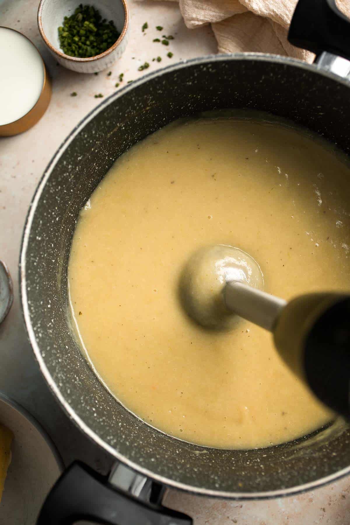 This Potato Leek Soup recipe is a classic for good reason! This creamy and velvety soup is quick and easy to make in 30 minutes using 8 ingredients. | aheadofthyme.com