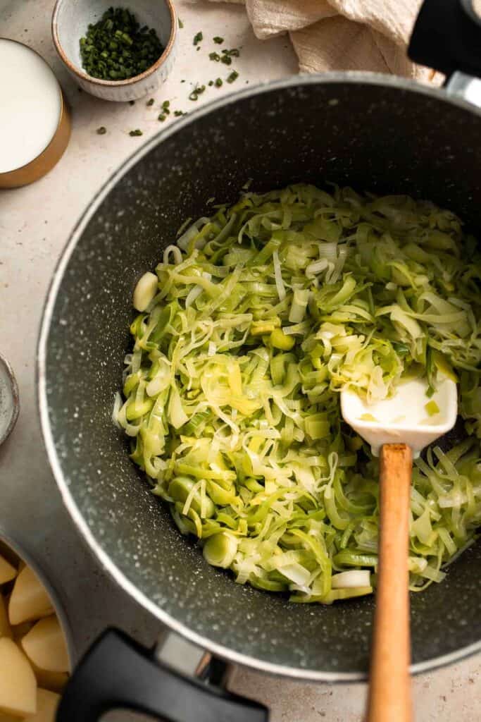 This Potato Leek Soup recipe is a classic for good reason! This creamy and velvety soup is quick and easy to make in 30 minutes using 8 ingredients. | aheadofthyme.com