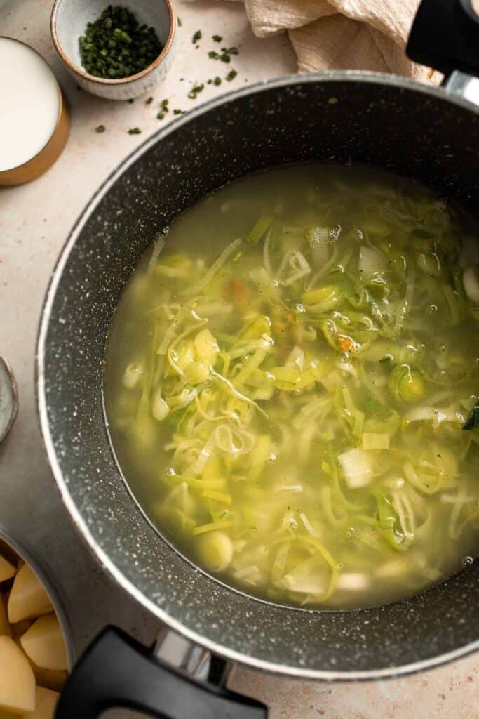 This Potato Leek Soup recipe is a classic for good reason! This creamy and velvety soup is quick and easy to make in 30 minutes using 8 ingredients. | aheadofthyme.com