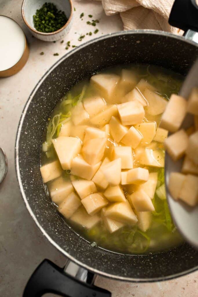 This Potato Leek Soup recipe is a classic for good reason! This creamy and velvety soup is quick and easy to make in 30 minutes using 8 ingredients. | aheadofthyme.com