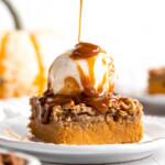 This easy Pumpkin Dump Cake recipe is loaded with fall flavors from the homemade pumpkin pie filling topped with spice cake mix and pecans. | aheadofthyme.com