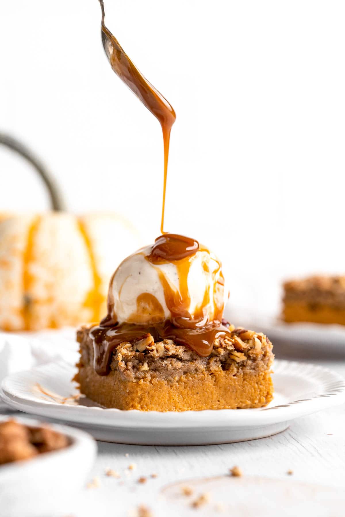 This easy Pumpkin Dump Cake recipe is loaded with fall flavors from the homemade pumpkin pie filling topped with spice cake mix and pecans. | aheadofthyme.com