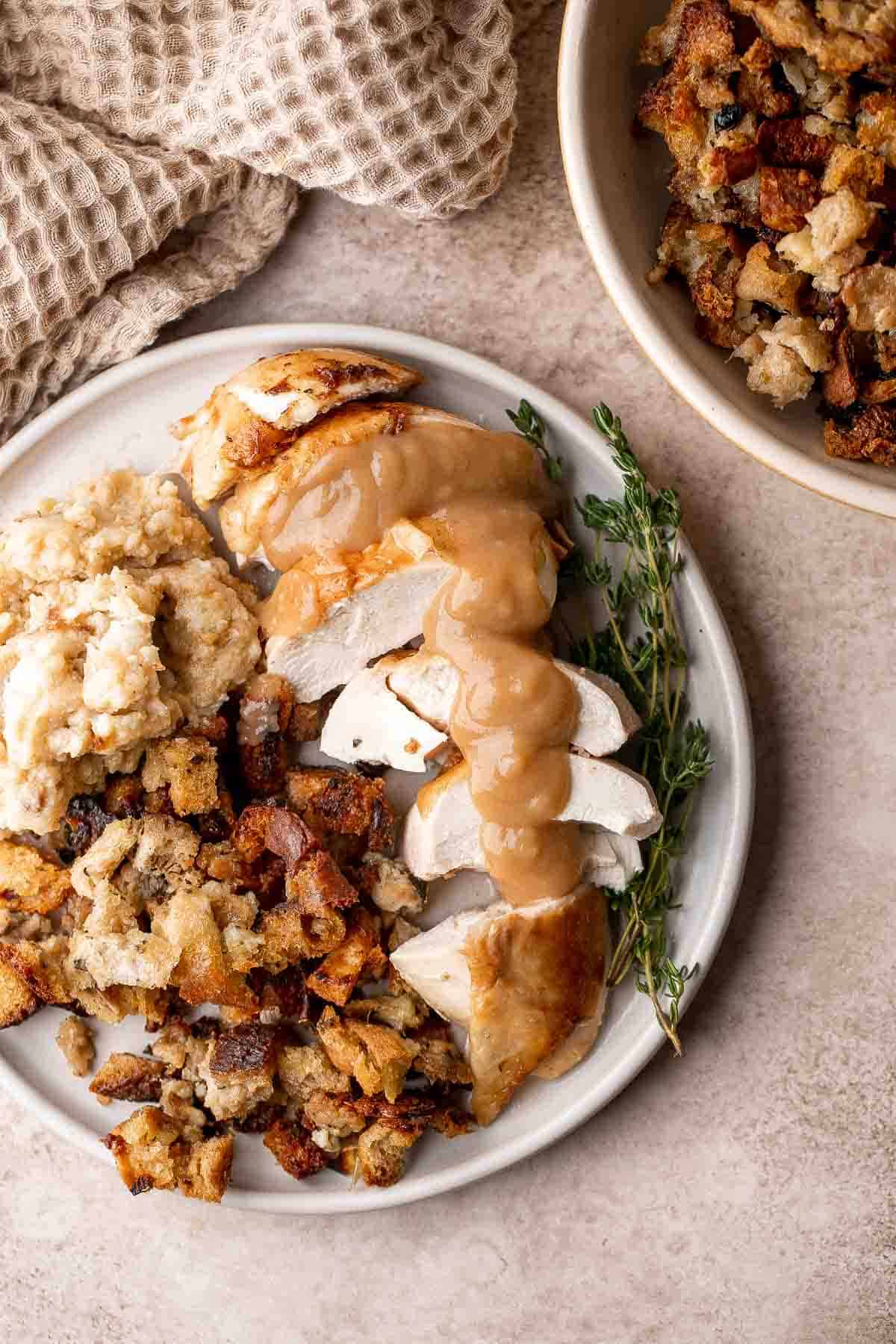 Roast Stuffed Chicken is easy to make and has everything you need for a meal in one pan. Serve it for a special occasion or weekly for Sunday roast dinner. | aheadofthyme.com