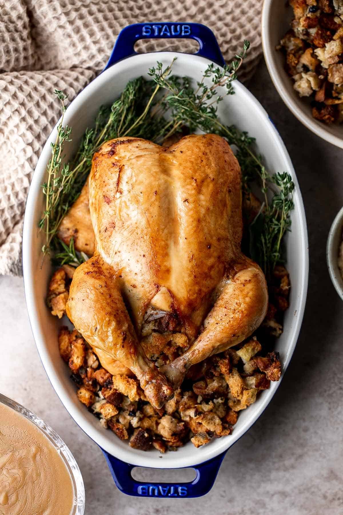 Roast Stuffed Chicken is easy to make and has everything you need for a meal in one pan. Serve it for a special occasion or weekly for Sunday roast dinner. | aheadofthyme.com