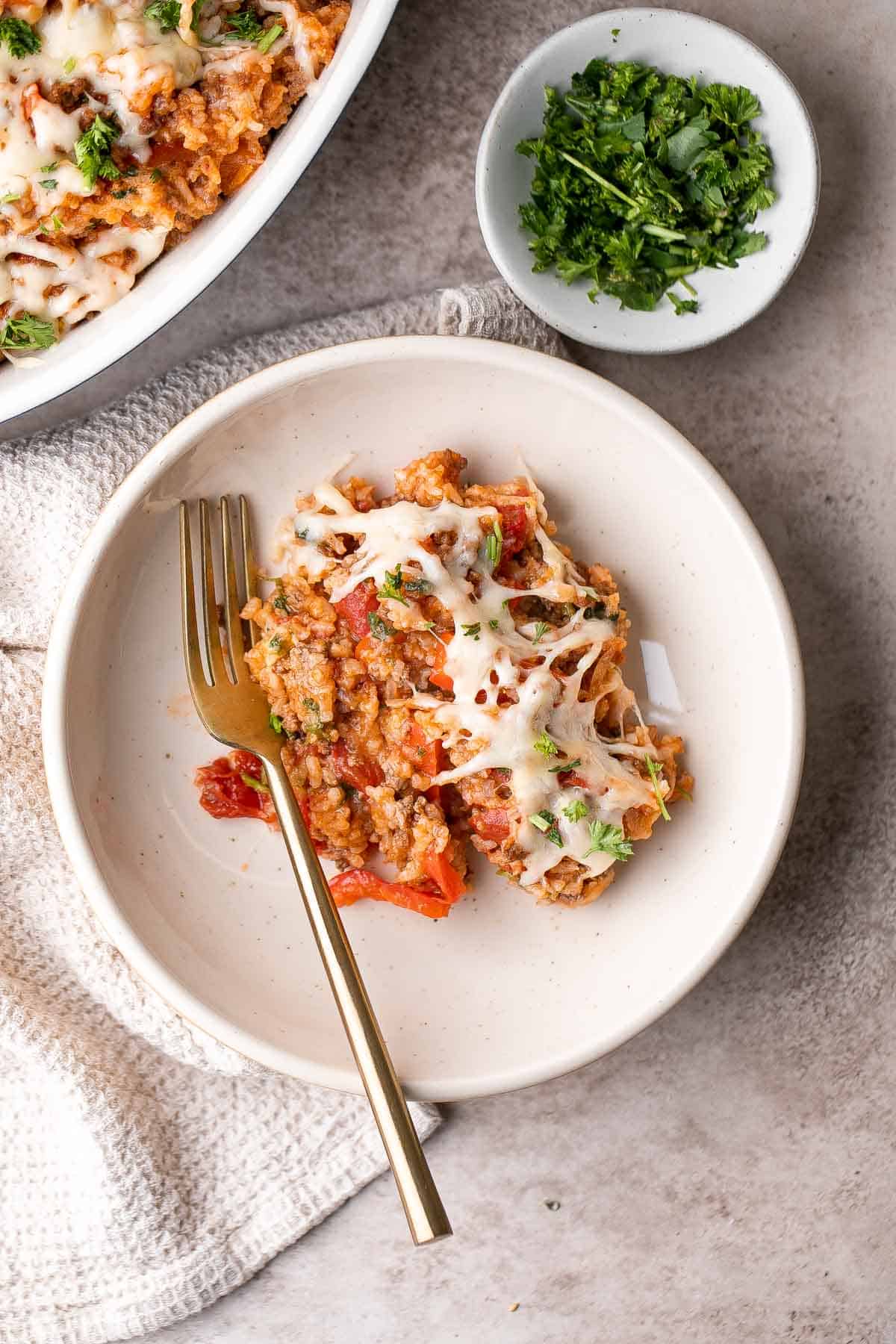 Skip the stuffing process with this easy Stuffed Pepper Casserole and cook the peppers with beef, rice, tomatoes, and spices for a delicious one pot meal. | aheadofthyme.com