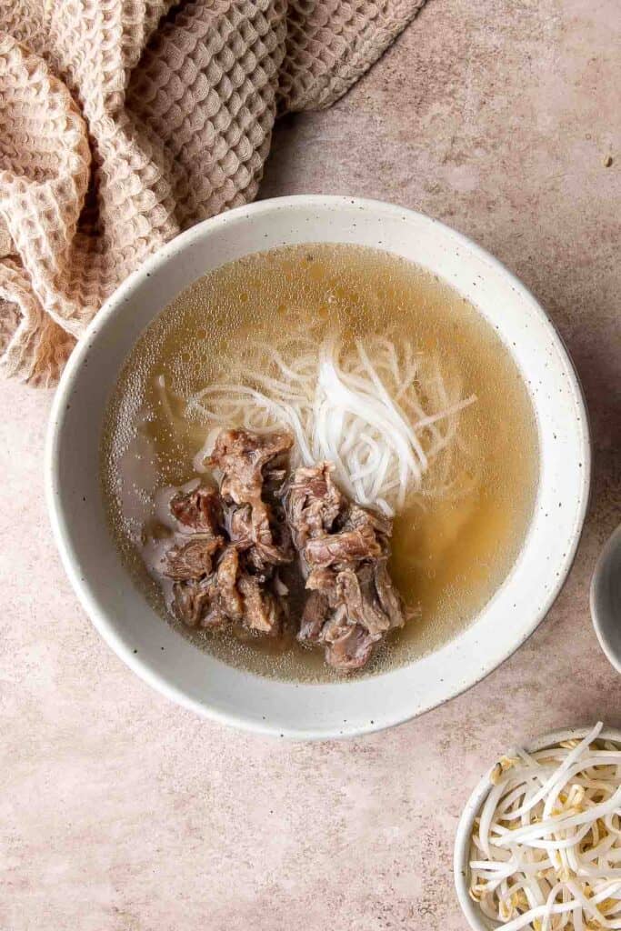 Vietnamese Pho is a one-of-a-kind soup known for its aromatic beef broth served over tender rice noodles, beef sirloin, fresh herbs, and other garnishes. | aheadofthyme.com