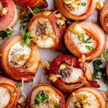 Bacon Wrapped Scallops are the most decadent appetizer to serve at your next part. Tender, fresh scallops are wrapped in bacon slices before baked. | aheadofthyme.com