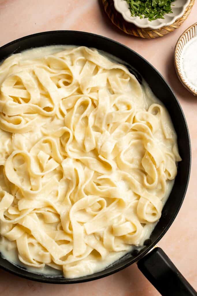 Creamy Cauliflower Alfredo is the perfect way to enjoy your favorite comfort food dinner while sneaking in extra veggies. It tastes like the real thing! | aheadofthyme.com