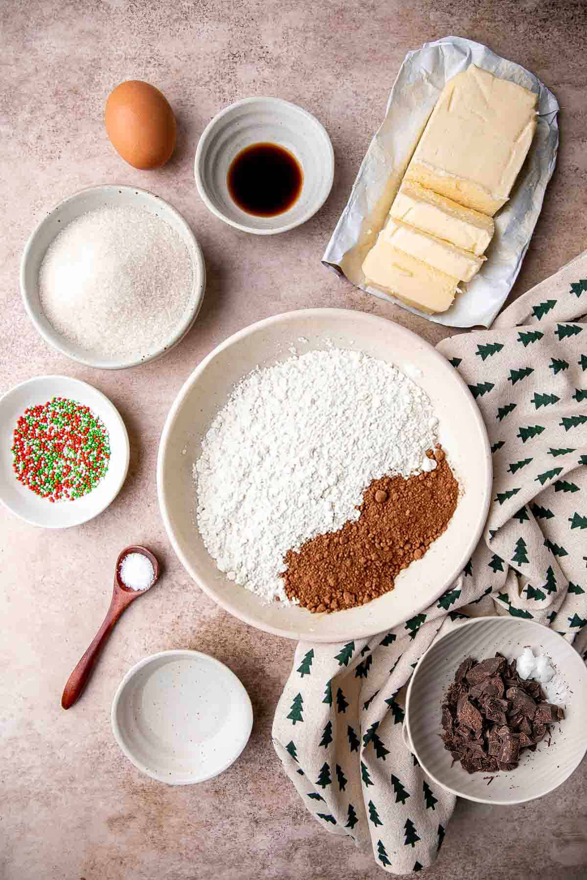 Chocolate Spritz Cookies are a rich and indulgent twist on classic buttery spritz cookies. Dip them in extra chocolate or top with colorful sprinkles. | aheadofthyme.com