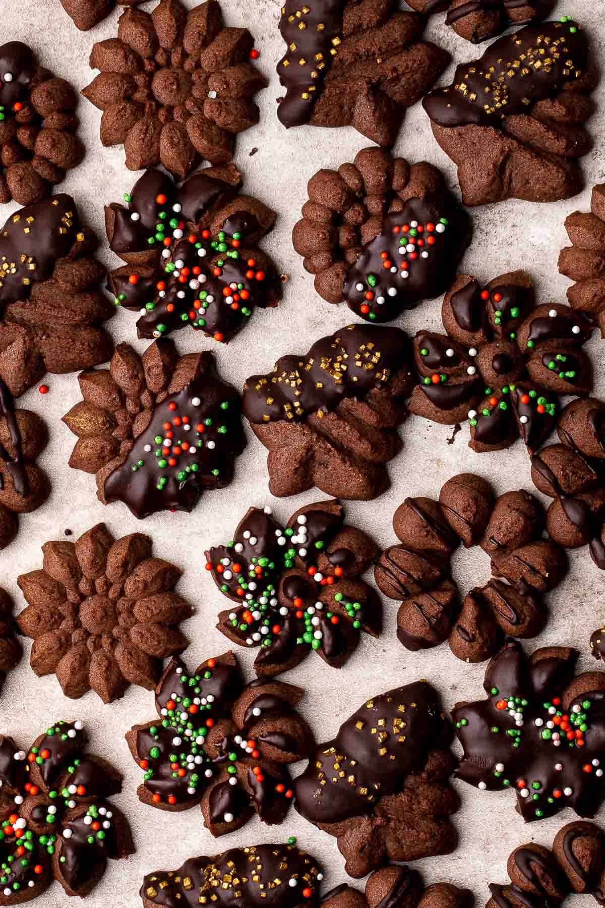 Chocolate Spritz Cookies are a rich and indulgent twist on classic buttery spritz cookies. Dip them in extra chocolate or top with colorful sprinkles. | aheadofthyme.com