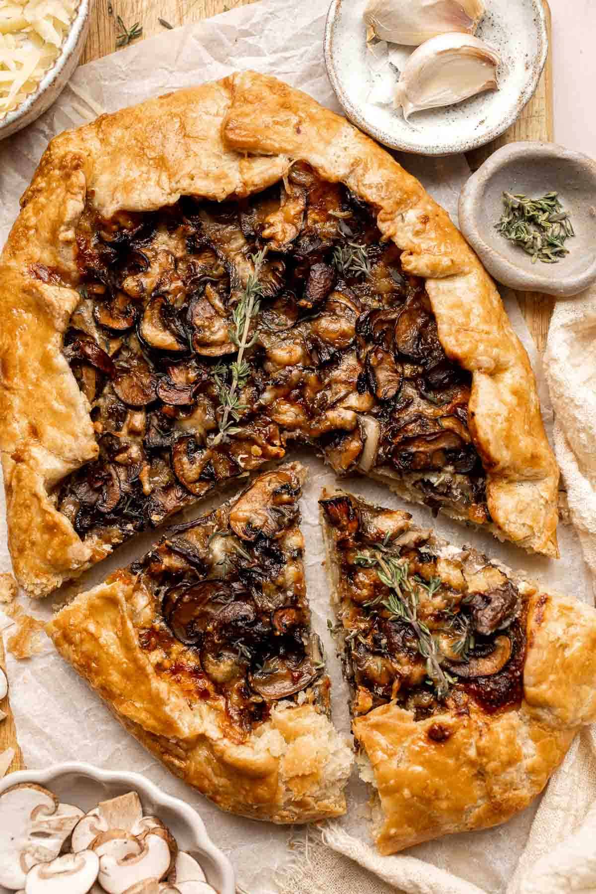 Made with homemade pie crust and an earthy, cheesy mushroom filling, this savory Mushroom Galette is an absolute delight. Serve for appetizer or side dish. | aheadofthyme.com