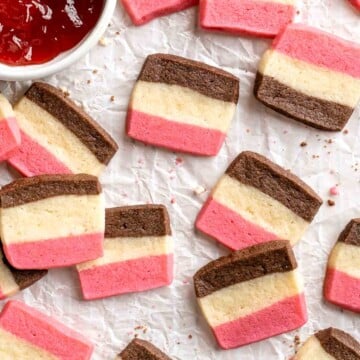 With their iconic pink, brown, and white stripes, these homemade Neapolitan Cookies are both beautiful and delicious. Made with 3 flavors in one dough! | aheadofthyme.com