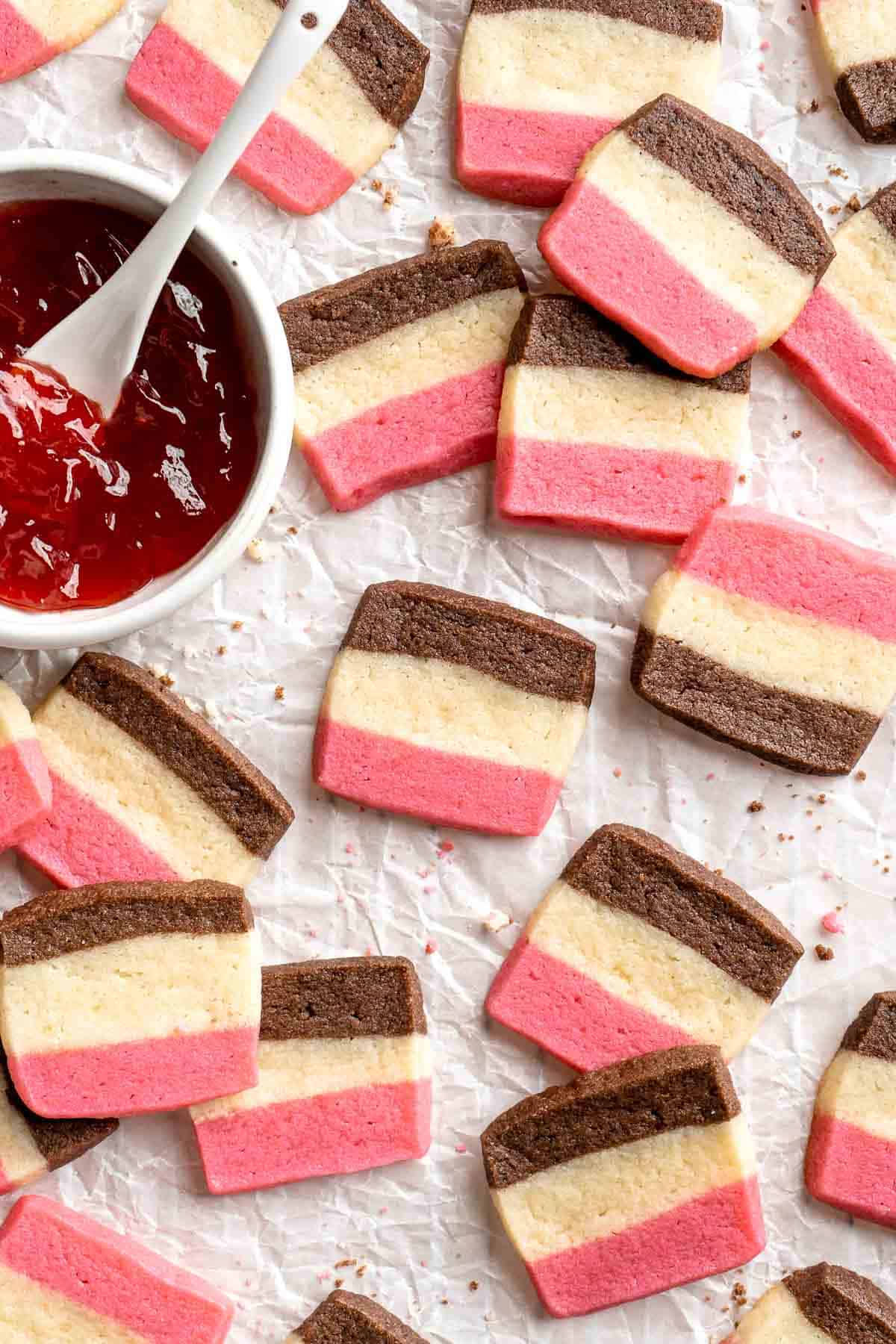 With their iconic pink, brown, and white stripes, these homemade Neapolitan Cookies are both beautiful and delicious. Made with 3 flavors in one dough! | aheadofthyme.com