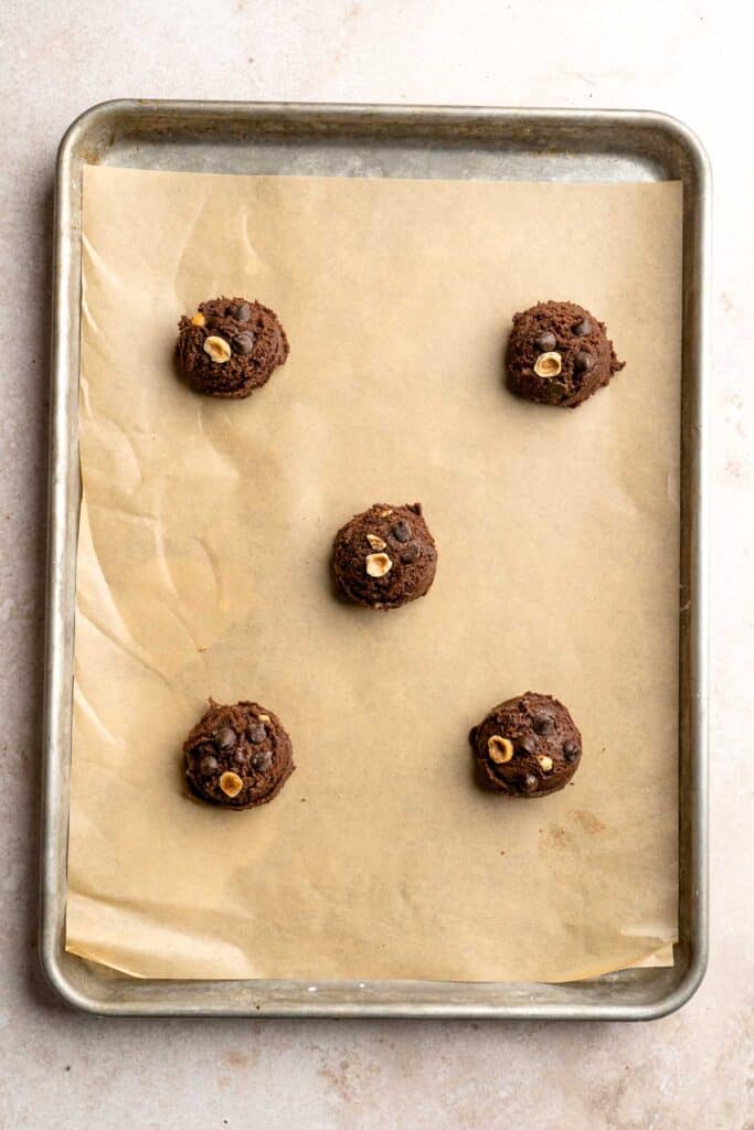 These homemade Nutella Cookies are tender, delicious, and chewy, loaded with chocolate chips, chopped hazelnut pieces, and homemade Nutella chips. | aheadofthyme.com