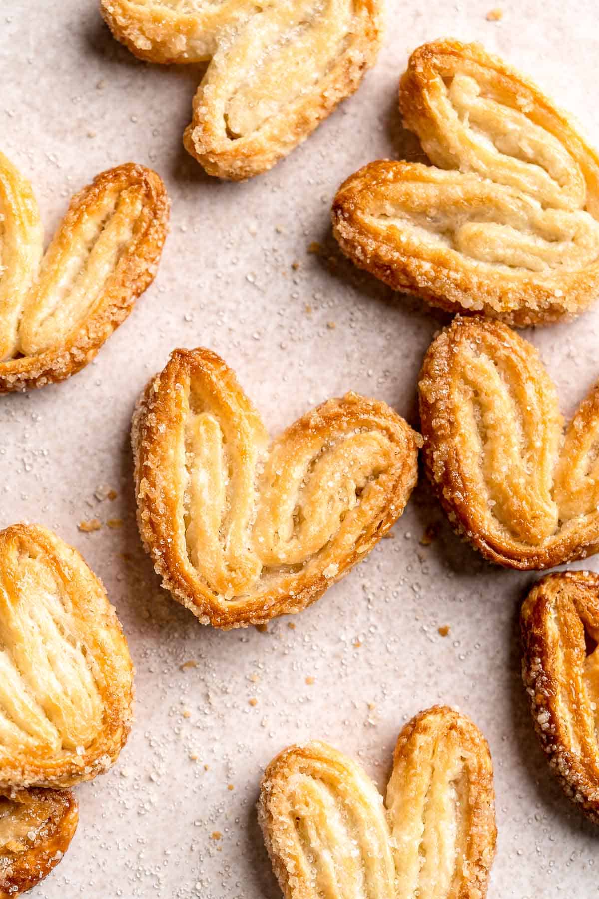 Palmiers are light, crunchy, swirled treats you can easily make in under 30 minutes using just 2 ingredients. They're buttery, crispy, flaky, and sweet. | aheadofthyme.com