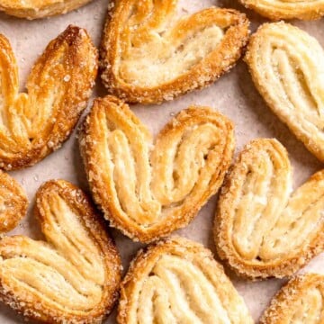 Palmiers are light, crunchy, swirled treats you can easily make in under 30 minutes using just 2 ingredients. They're buttery, crispy, flaky, and sweet. | aheadofthyme.com