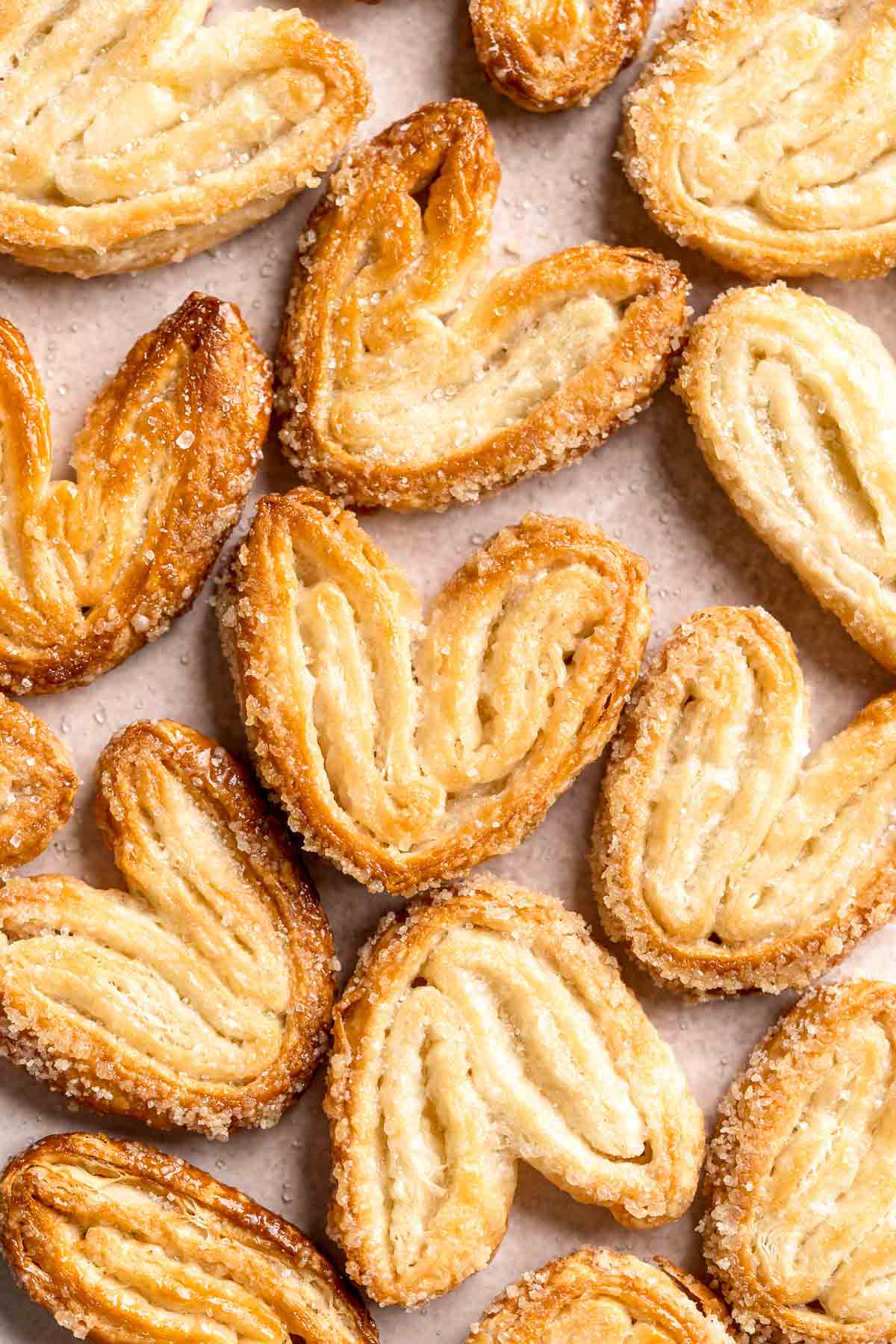 Palmiers are light, crunchy, swirled treats you can easily make in under 30 minutes using just 2 ingredients. They're buttery, crispy, flaky, and sweet. | aheadofthyme.com