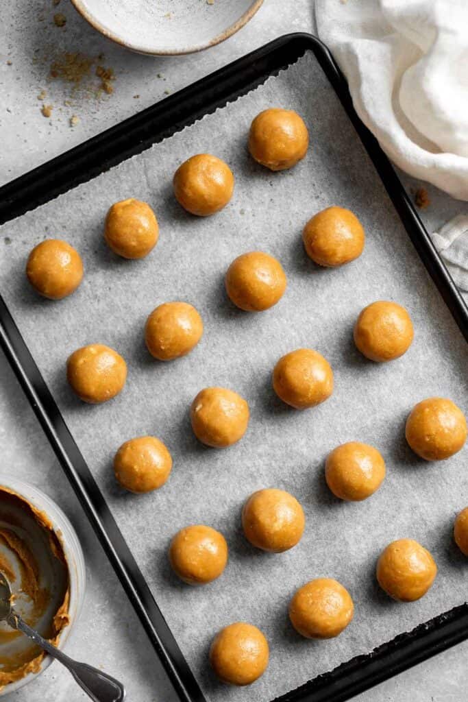 Soft, sweet, and creamy, these no bake Peanut Butter Balls are perfect as bite-sized treats for the holidays or any day you need a little pick-me-up. | aheadofthyme.com