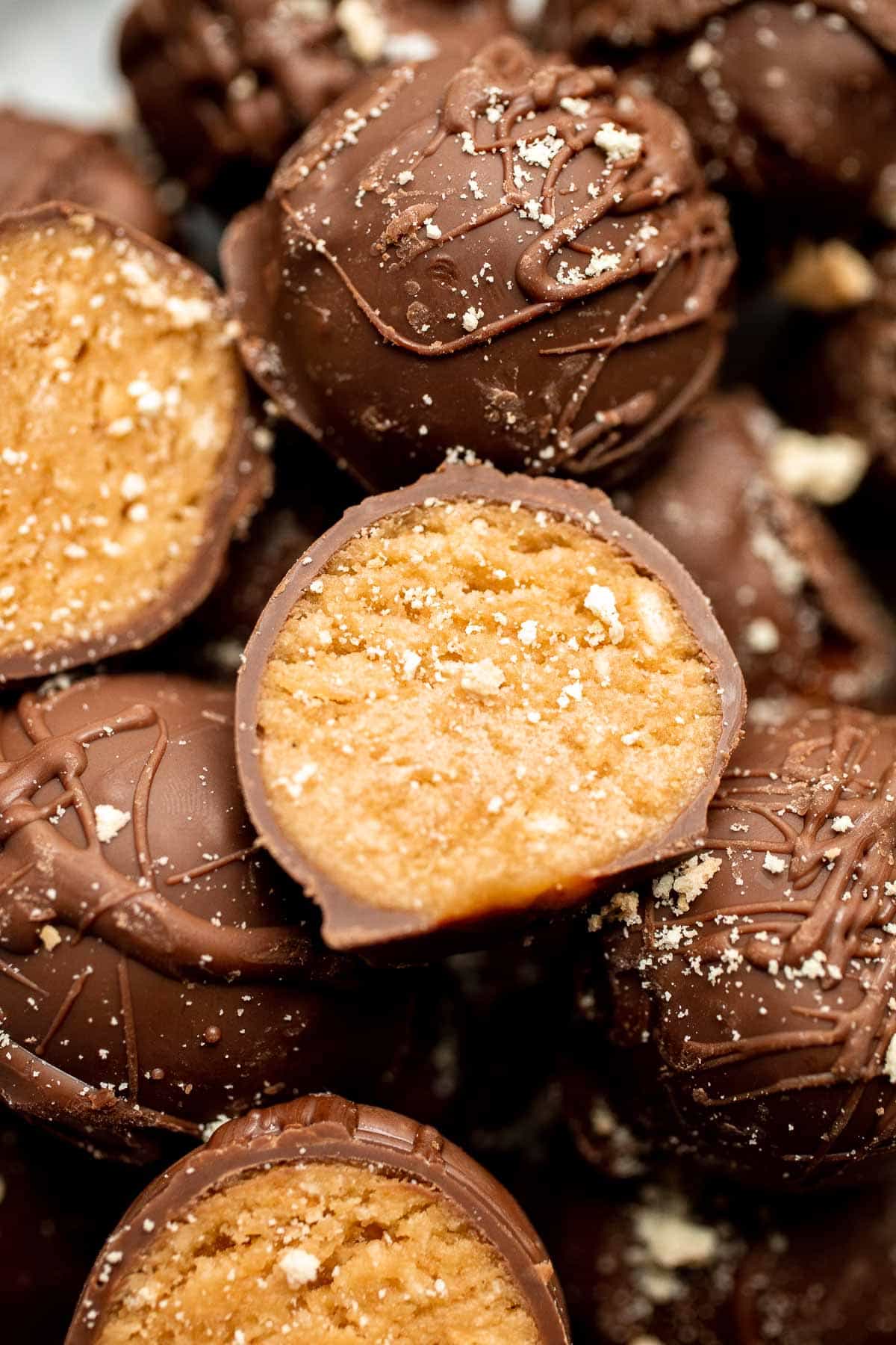 Soft, sweet, and creamy, these no bake Peanut Butter Balls are perfect as bite-sized treats for the holidays or any day you need a little pick-me-up. | aheadofthyme.com