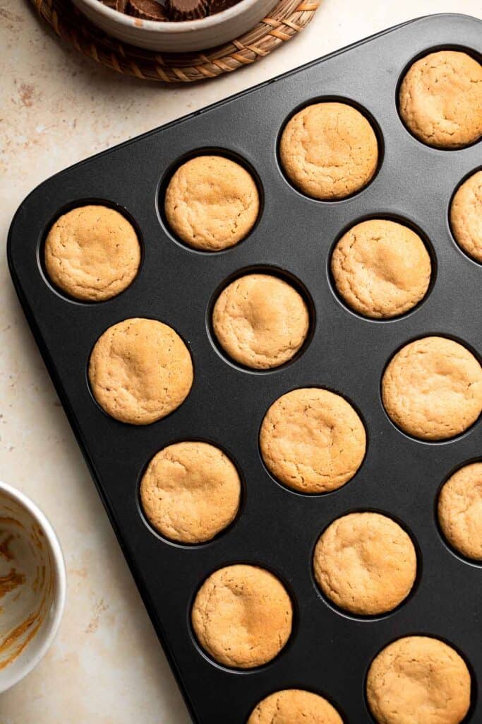 Easy Peanut Butter Cup Cookies are tall and thick, classic Christmas cookies made with peanut butter cookie dough and a mini Reese's cup pressed in. | aheadofthyme.com