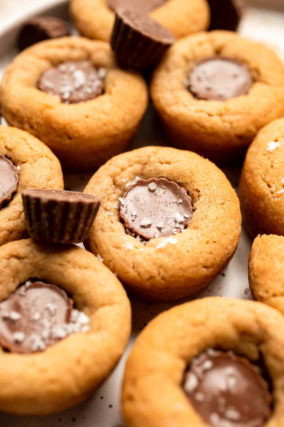 Easy Peanut Butter Cup Cookies are tall and thick, classic Christmas cookies made with peanut butter cookie dough and a mini Reese's cup pressed in. | aheadofthyme.com