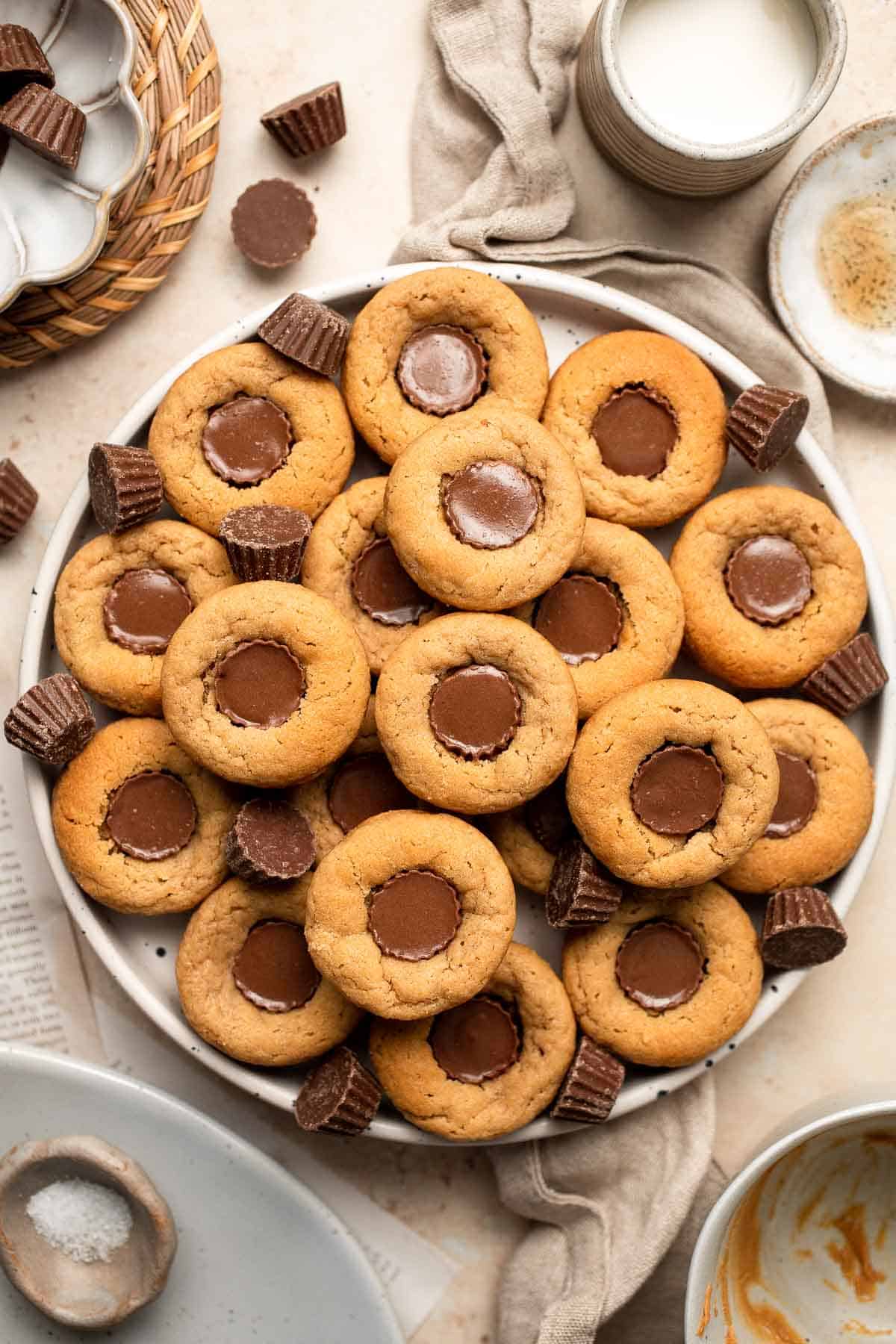 Easy Peanut Butter Cup Cookies are tall and thick, classic Christmas cookies made with peanut butter cookie dough and a mini Reese's cup pressed in. | aheadofthyme.com