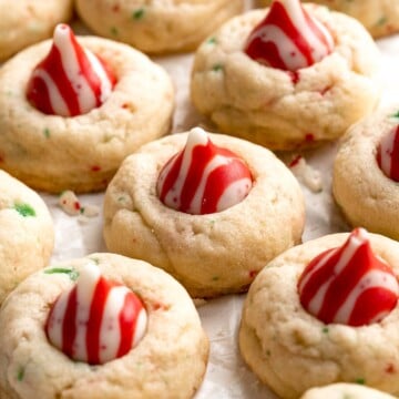 Sweet and crunchy Peppermint Kiss Cookies are the perfect Christmas cookies made with a sugar cookie dough, real candy canes, and a peppermint kiss on top. | aheadofthyme.com