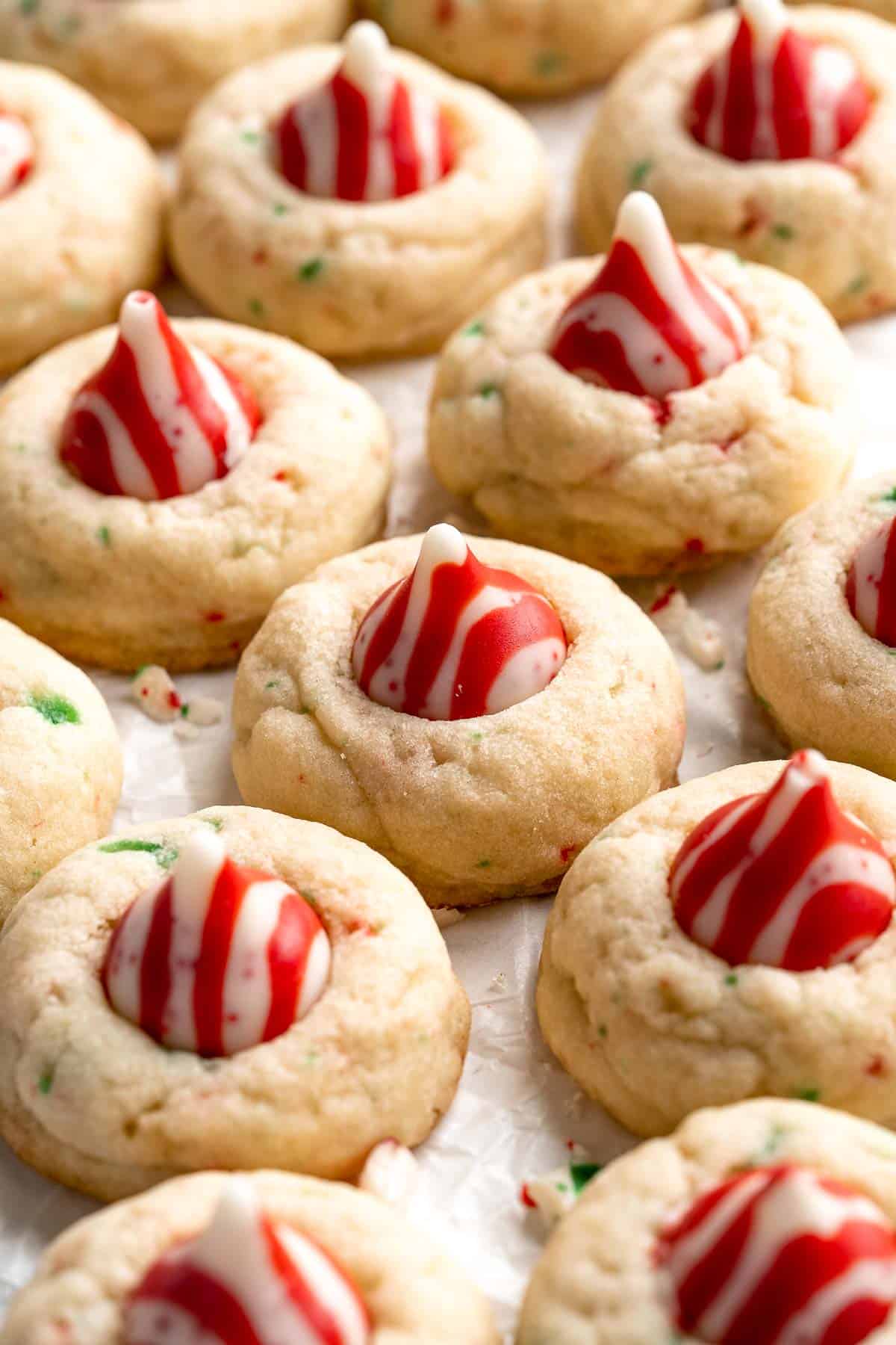 Sweet and crunchy Peppermint Kiss Cookies are the perfect Christmas cookies made with a sugar cookie dough, real candy canes, and a peppermint kiss on top. | aheadofthyme.com