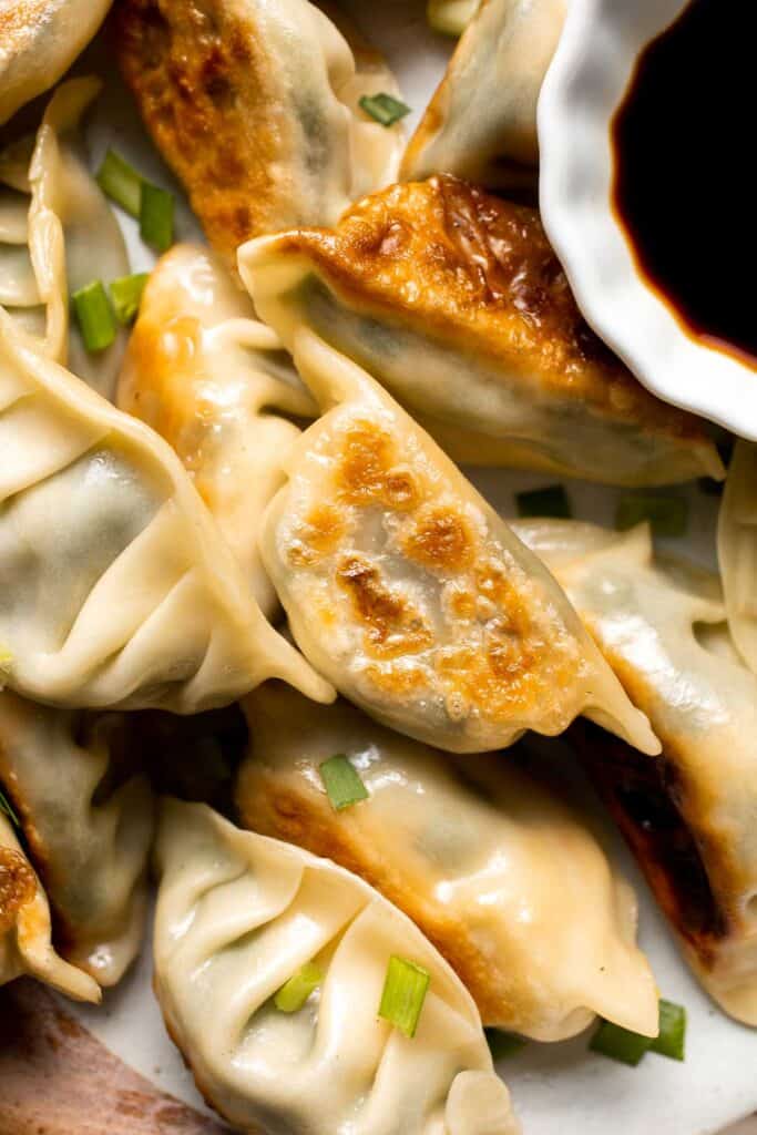 Homemade Chicken Potstickers have a crispy shell on the outside with a burst of delicious chicken filling on the inside that's seasoned to perfection. | aheadofthyme.com