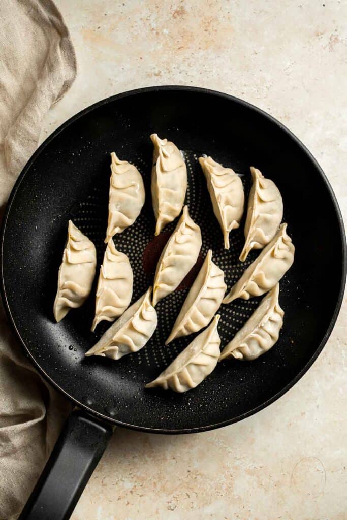 Homemade Chicken Potstickers have a crispy shell on the outside with a burst of delicious chicken filling on the inside that's seasoned to perfection. | aheadofthyme.com