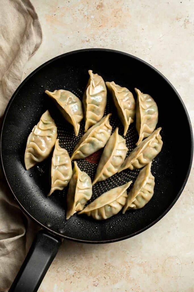 Homemade Chicken Potstickers have a crispy shell on the outside with a burst of delicious chicken filling on the inside that's seasoned to perfection. | aheadofthyme.com