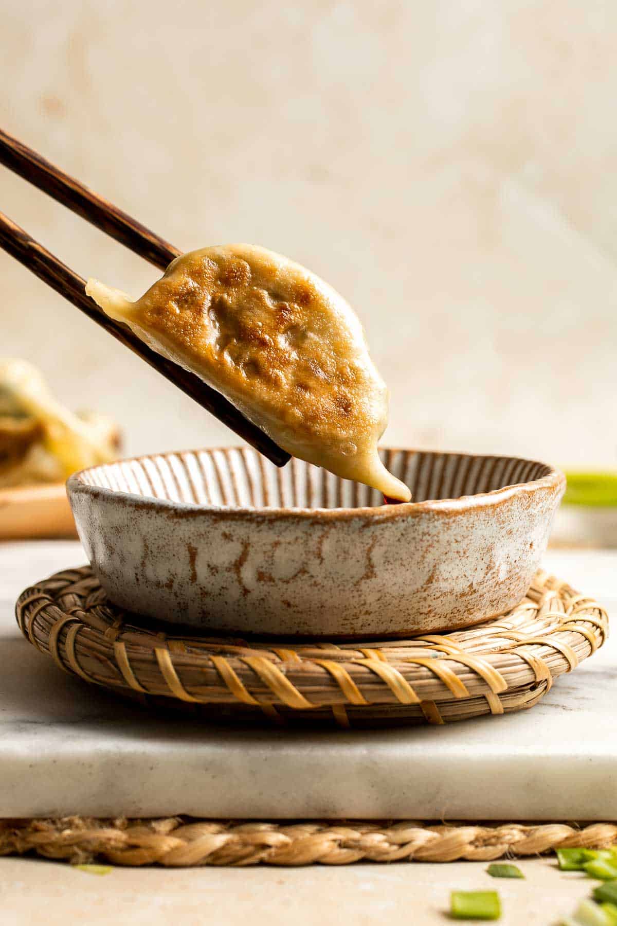 Homemade Chicken Potstickers have a crispy shell on the outside with a burst of delicious chicken filling on the inside that's seasoned to perfection. | aheadofthyme.com