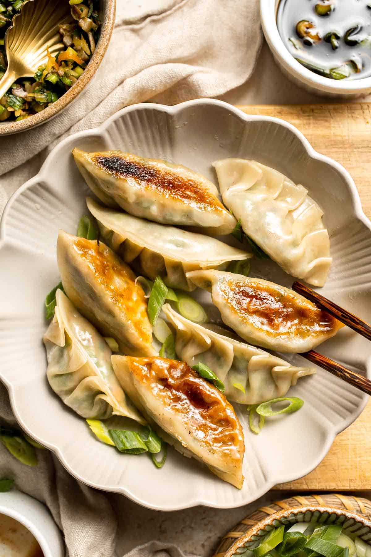 Homemade Chicken Potstickers have a crispy shell on the outside with a burst of delicious chicken filling on the inside that's seasoned to perfection. | aheadofthyme.com
