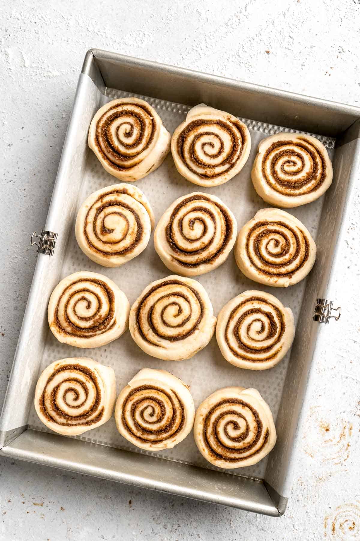 Gingerbread Cinnamon Rolls are made with a rich gingerbread filling and topped with cream cheese frosting. A must-have during the holiday season! | aheadofthyme.com