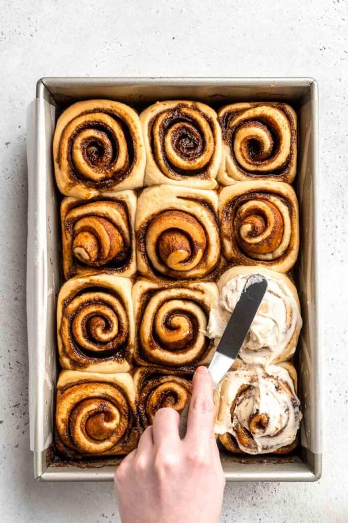 Gingerbread Cinnamon Rolls are made with a rich gingerbread filling and topped with cream cheese frosting. A must-have during the holiday season! | aheadofthyme.com