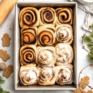 Gingerbread Cinnamon Rolls are made with a rich gingerbread filling and topped with cream cheese frosting. A must-have during the holiday season! | aheadofthyme.com