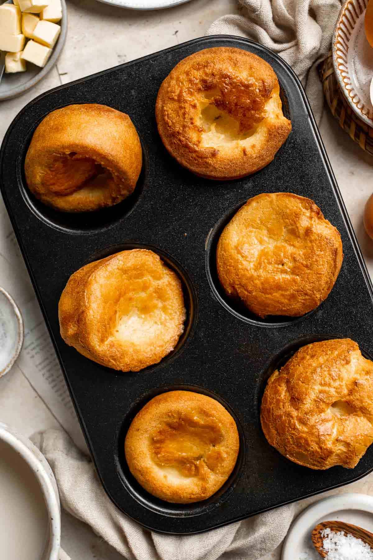 Popovers (or Yorkshire pudding) are light, puffed rolls that "pop over" the top of the pan and are a must-have to serve with your Sunday roast. | aheadofthyme.com