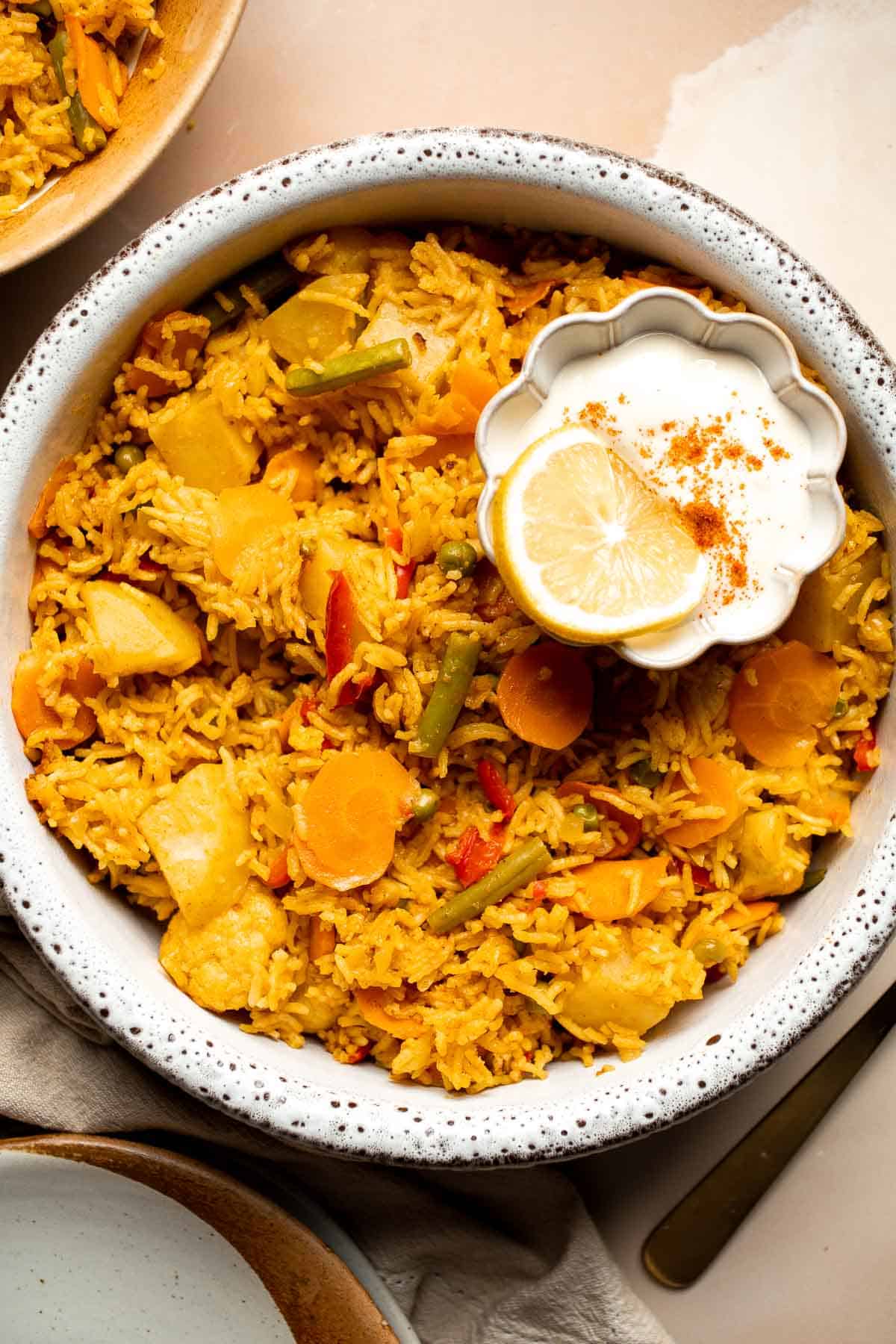 This Vegetable Biryani is a warming and comforting recipe, that is full of flavor and many different textures, making it the ultimate vegetarian side dish. | aheadofthyme.com