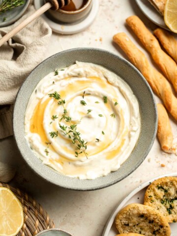 Whipped Goat Cheese is a delicious and creamy appetizer dip or spread you can easily make at home in 5 minutes. It's light, fluffy, and tangy. | aheadofthyme.com