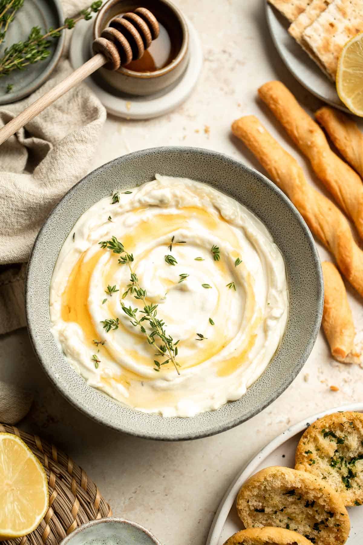 Whipped Goat Cheese is a delicious and creamy appetizer dip or spread you can easily make at home in 5 minutes. It's light, fluffy, and tangy. | aheadofthyme.com