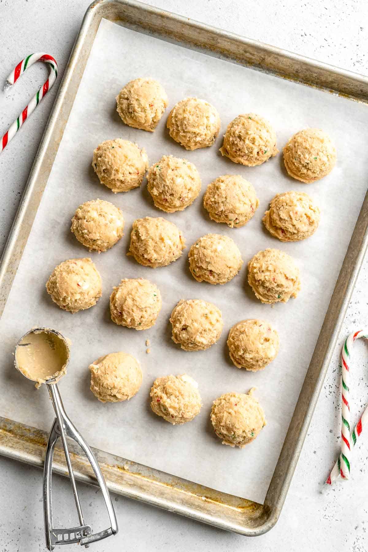 Sweet and chewy with little pops of candy canes, these White Chocolate Peppermint Cookies taste like Christmas in cookie form! Quick and easy too! | aheadofthyme.com