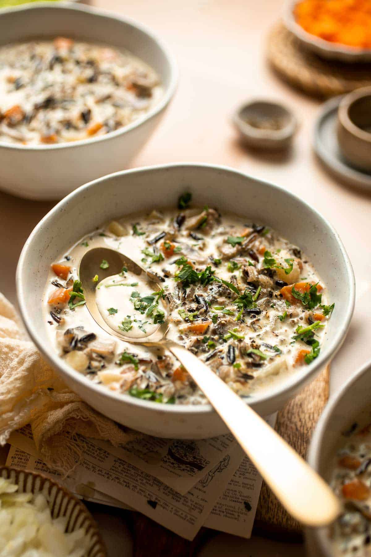 This homemade Creamy Wild Rice Soup is a simple recipe made with mushrooms, nutty wild rice, and yellow potatoes to offer a variety of textures and flavors. | aheadofthyme.com