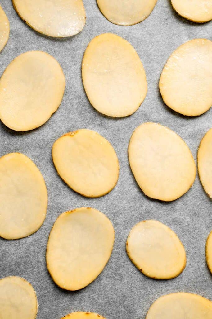 With a perfectly crisp crunch and a slightly salty flavor, these Homemade Baked Potato Chips are so much better than the prepackaged chips at the store. | aheadofthyme.com