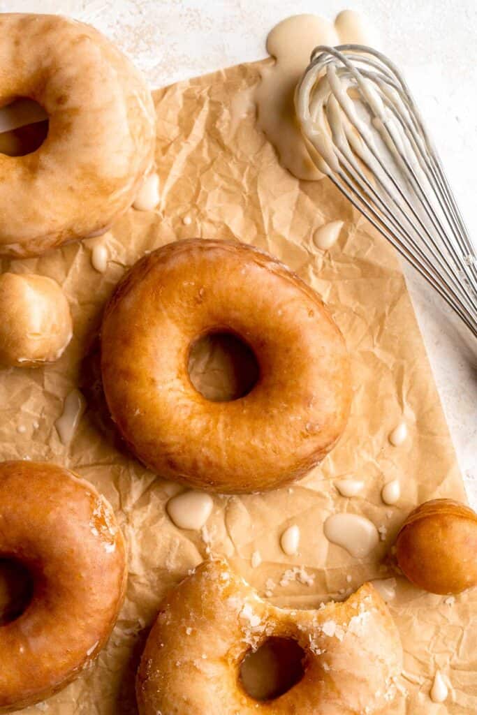 Homemade Glazed Donuts are made with tender, pillowy dough and topped with a sweet glaze. Making doughnuts at home are a lot easier than you'd think! | aheadofthyme.com