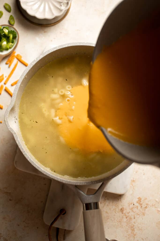 This decadent Mac and Cheese Soup is everything you love about macaroni and cheese turned into a rich and creamy soup. Ready in just 30 minutes! | aheadofthyme.com