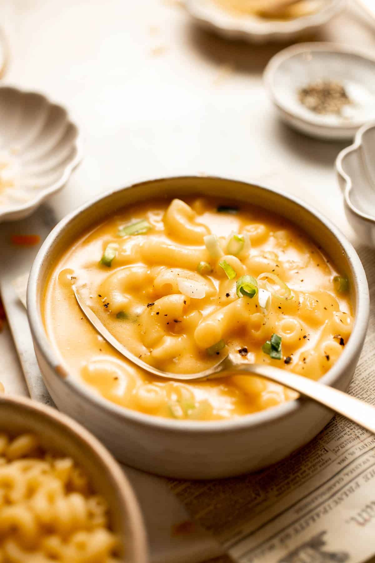 This decadent Mac and Cheese Soup is everything you love about macaroni and cheese turned into a rich and creamy soup. Ready in just 30 minutes! | aheadofthyme.com