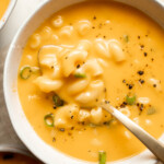 This decadent Mac and Cheese Soup is everything you love about macaroni and cheese turned into a rich and creamy soup. Ready in just 30 minutes! | aheadofthyme.com