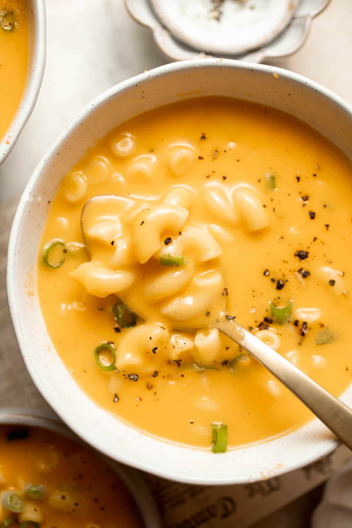 This decadent Mac and Cheese Soup is everything you love about macaroni and cheese turned into a rich and creamy soup. Ready in just 30 minutes! | aheadofthyme.com