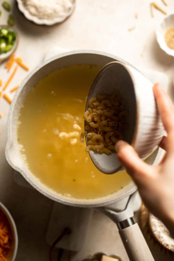 This decadent Mac and Cheese Soup is everything you love about macaroni and cheese turned into a rich and creamy soup. Ready in just 30 minutes! | aheadofthyme.com